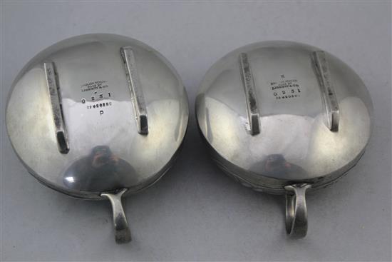 A Liberty Tudric pewter three piece tea set, no.0231, designed by Archibald Knox, teapot 9.75in.
